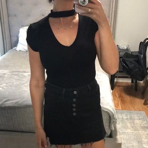 Black v neck short sleeve top with fabric across neck